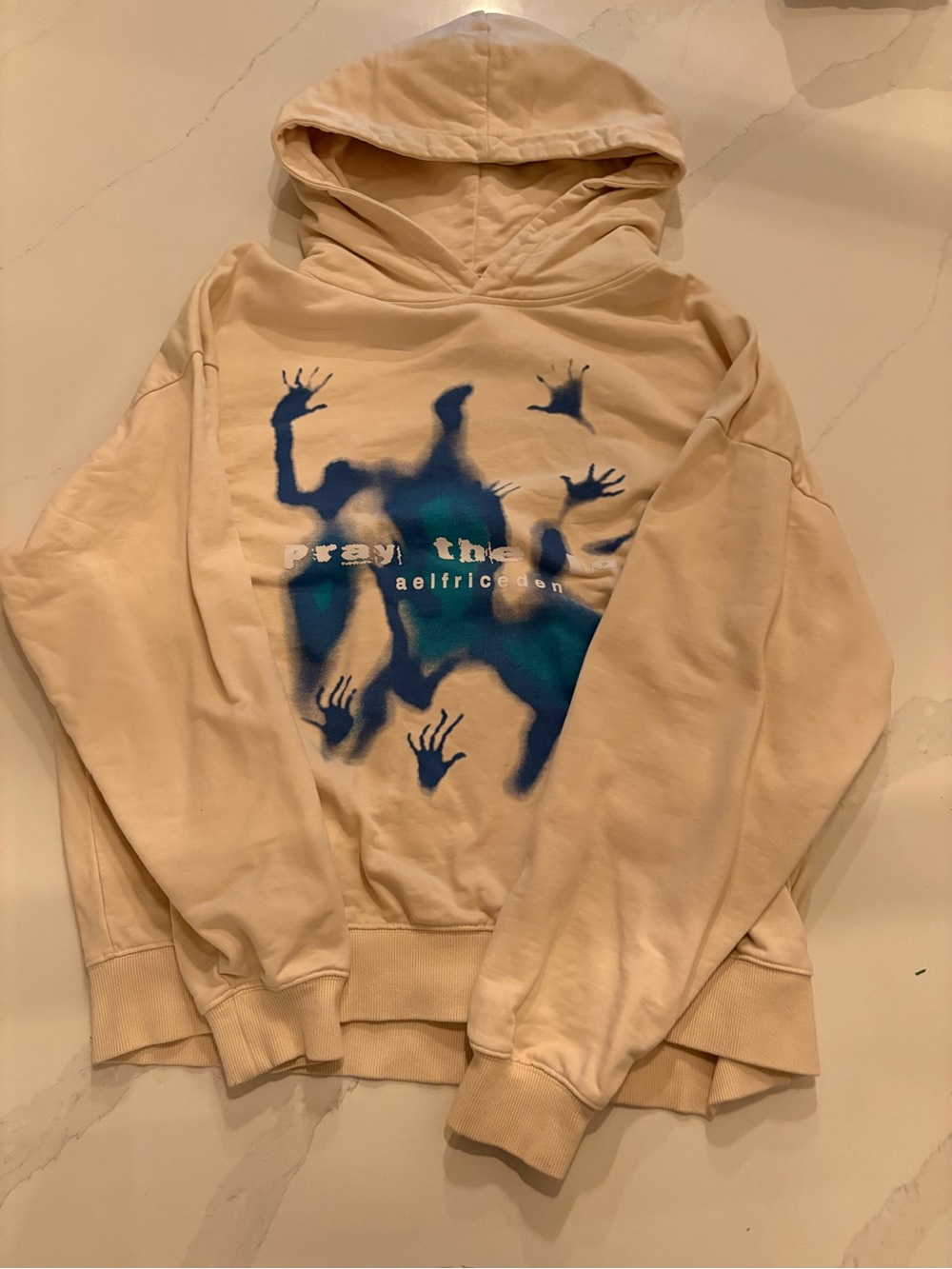 Aelfric Eden Cream Hoodie with Blue Graphic Print